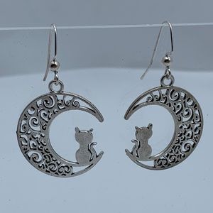 NWT. Handmade Cat Sitting on a Swirly Moon Pierced Dangle Earrings in Silver!